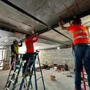 CEOS crew working overhead on ladders