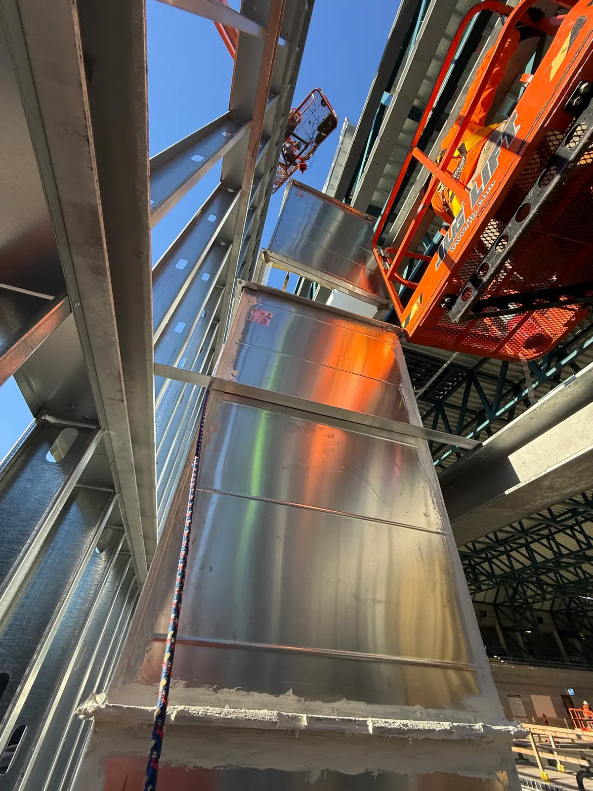 Large duct section rigged along the steel structure
